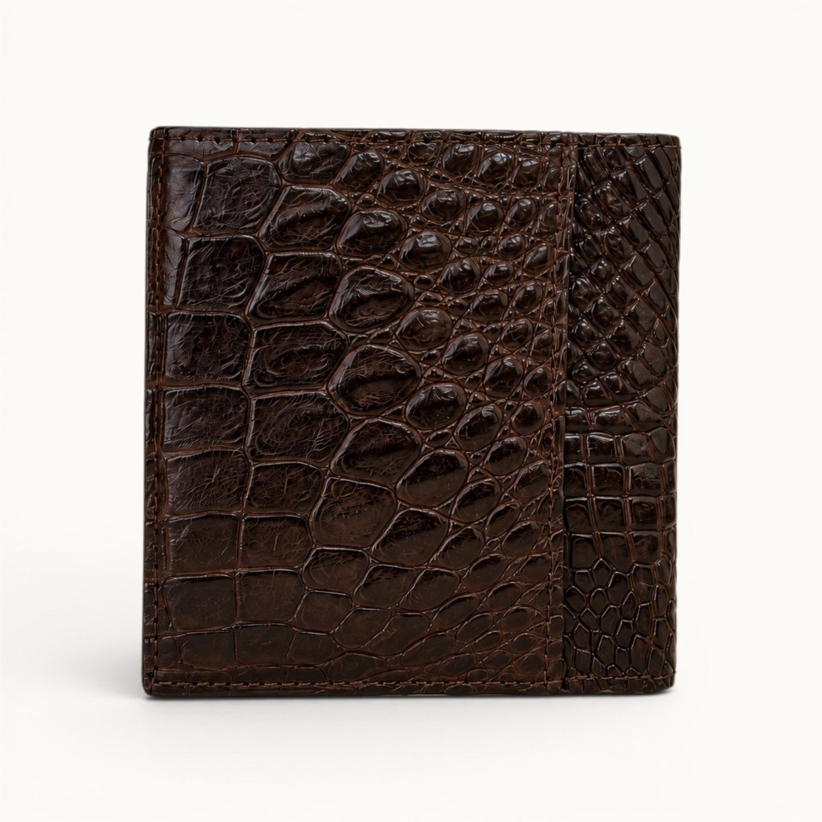 Herrington Espresso Brown Siamese crocodile trifold wallet shown from the rear, highlighting the exterior slip pocket, glossy scale texture, and precise edge stitching.