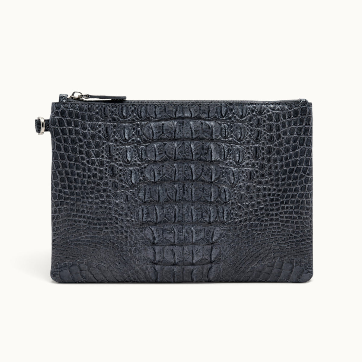 Gunmetal gray crocodile clutch bag with symmetrical natural scale detailing and zip closure