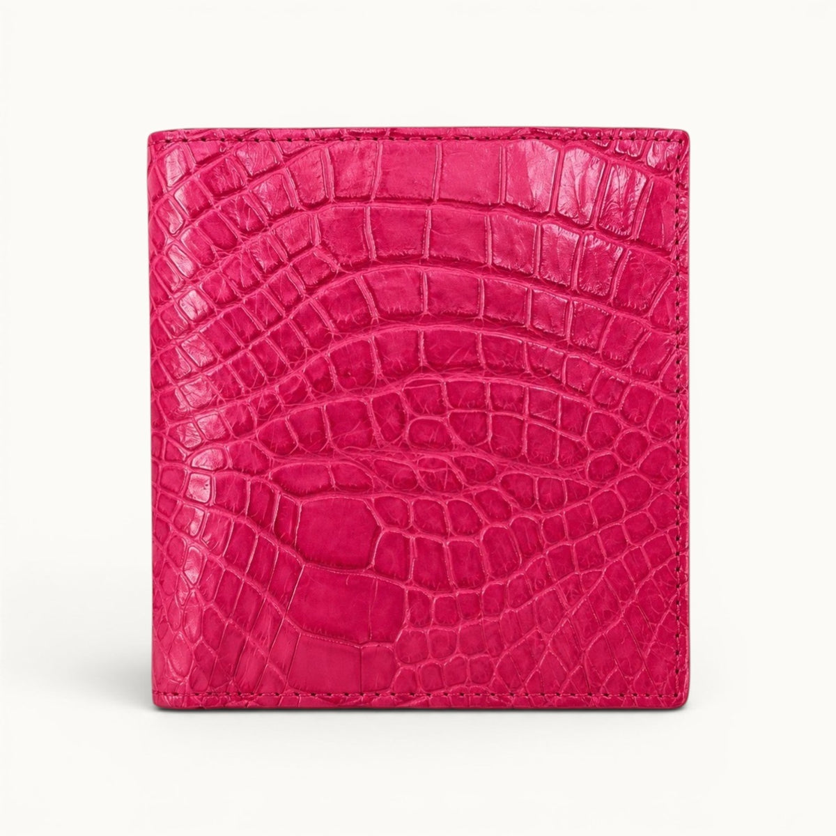 Herrington Bright Pink trifold wallet crafted from genuine Siamese crocodile leather, shown in a full front view with a distinctive natural scale pattern.