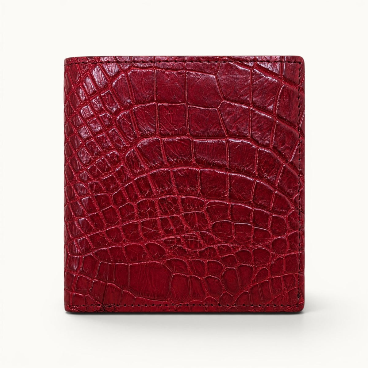 Herrington Cherry Red trifold wallet crafted from genuine Siamese crocodile leather, shown in a straight front view with rich color and distinctive natural scales.
