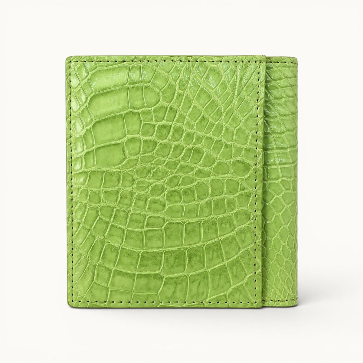 Herrington Lime Green Siamese crocodile trifold wallet shown from the back, featuring a full-width exterior slip pocket, vivid natural scales, and contrast stitching.