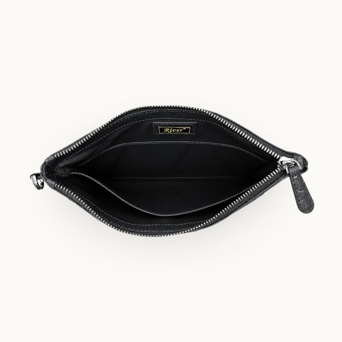 Luxury gunmetal gray zip clutch with coordinating leather interior and interior slip compartment
