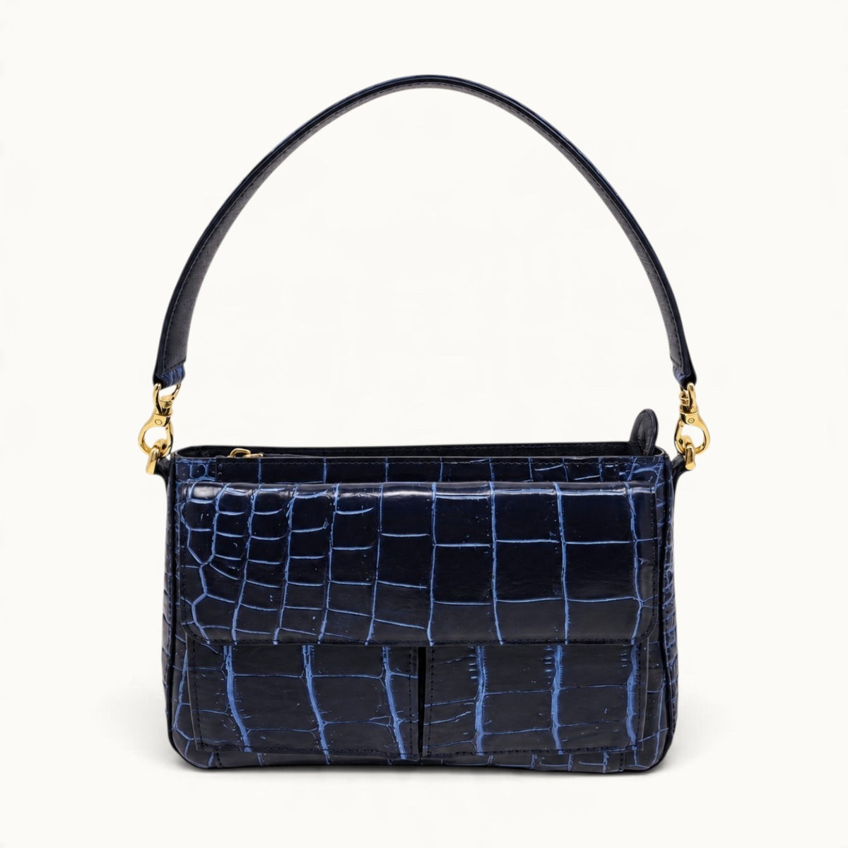 Front view of navy crocodile shoulder bag with short crocodile strap and polished gold hardware