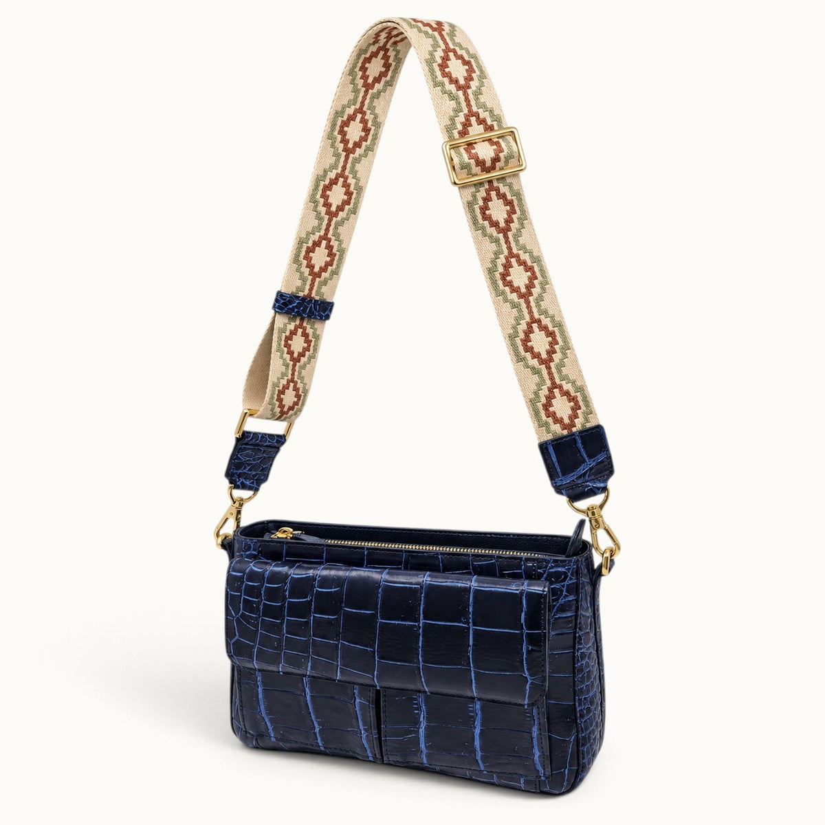 Navy crocodile shoulder bag with detachable patterned woven strap and gold-tone hardware