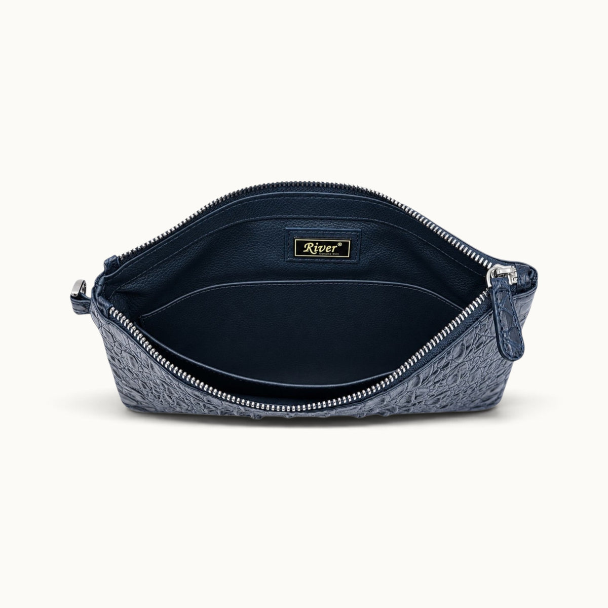 Deep navy crocodile clutch with matching leather interior, slip pocket and metal zipper