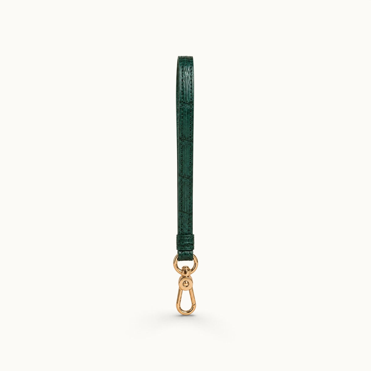 Full-length front view of the Emerald Green Stanhope crocodile wrist strap with polished gold-tone clasp.