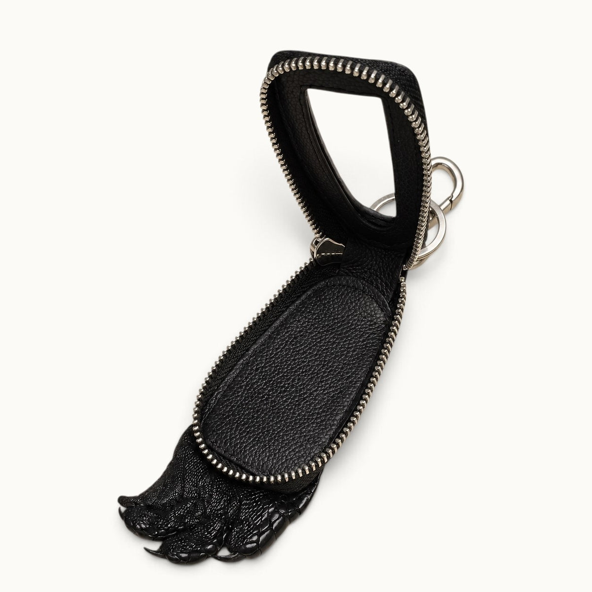 Open black Siamensis crocodile leather car key case showing the full-grain cow-leather interior, clear window, YKK zipper, silver hardware, and sculpted claw detail.