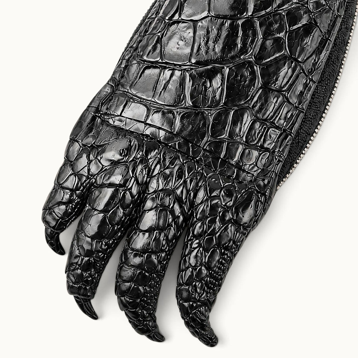 Close-up texture of the black Siamensis crocodile leather car key case, showing the natural scale pattern, glossy finish, and detailed claw texture.