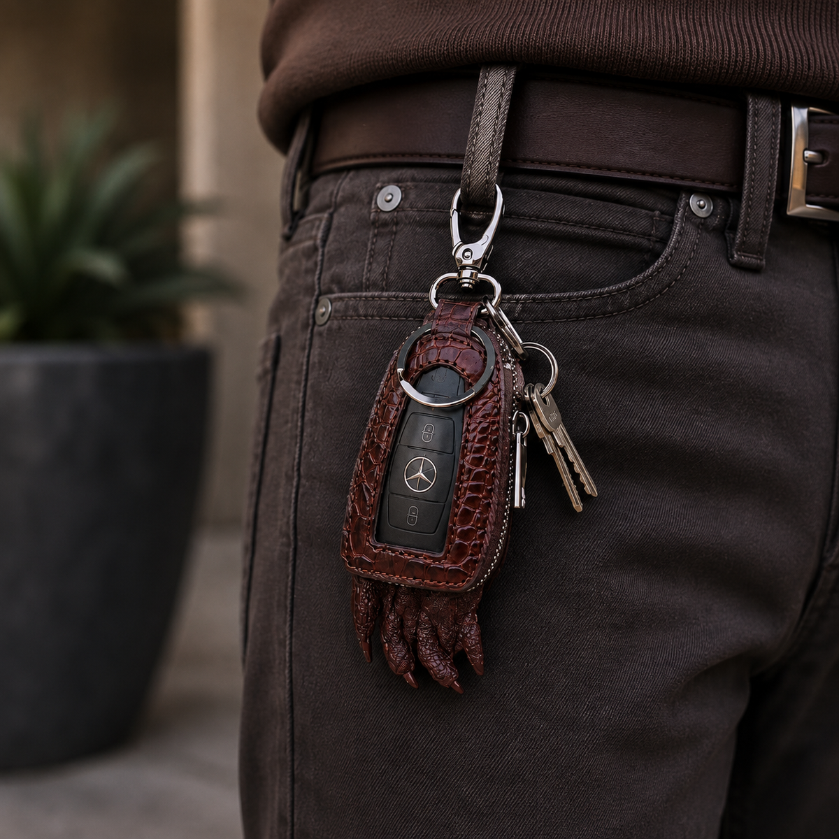 Brown Siamensis crocodile leather car key case with Mercedes remote and house keys clipped to a belt loop.