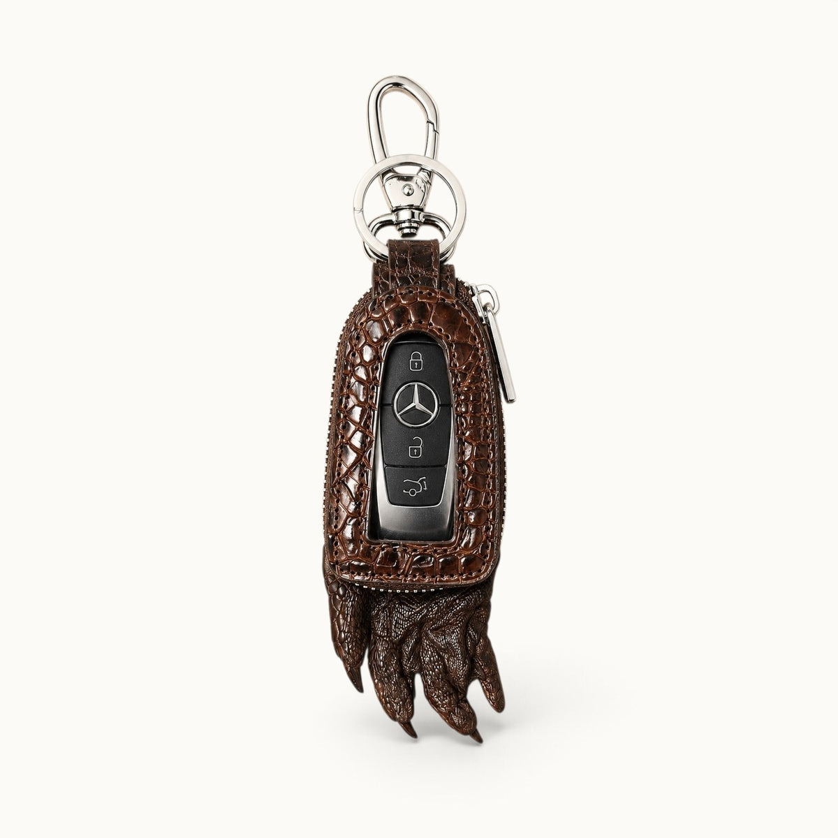 Brown Siamensis crocodile leather car key case with a Mercedes remote displayed through the clear front window.
