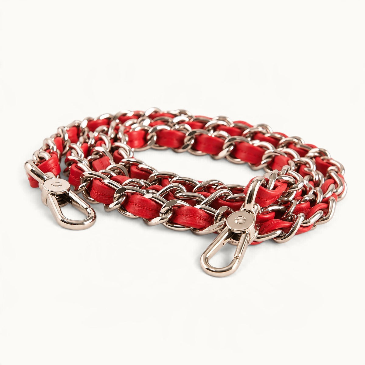 Detachable silver-tone chain strap interwoven with red full-grain cow leather, featuring polished metal clasps.