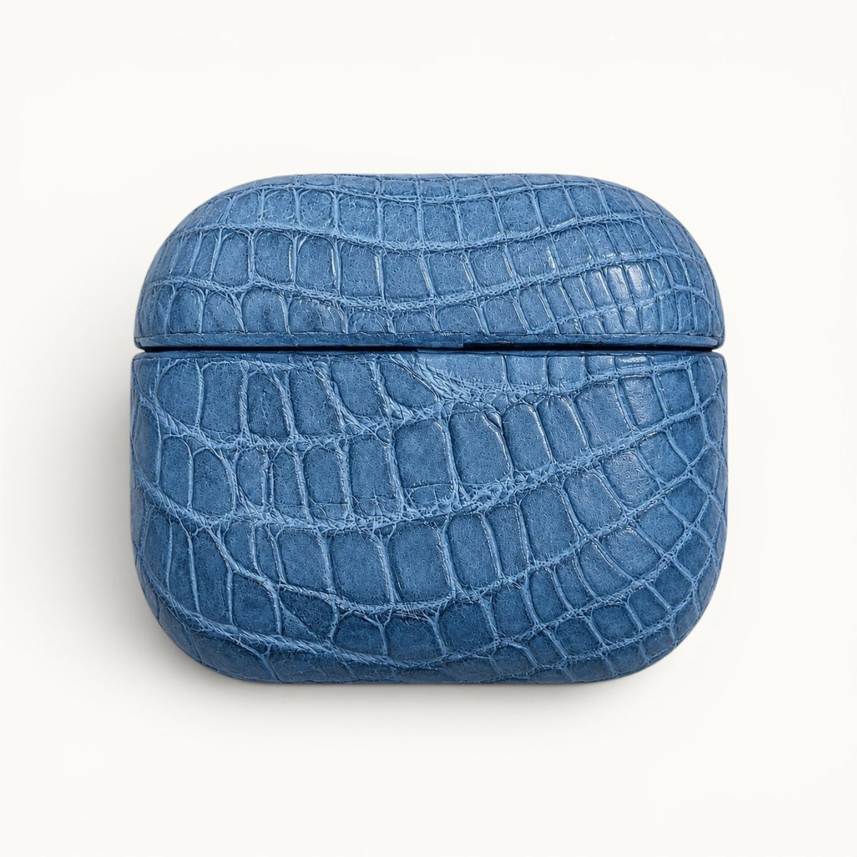 Front view of The Crocodile AirPods Case in French Blue handcrafted from genuine Siamese crocodile leather.