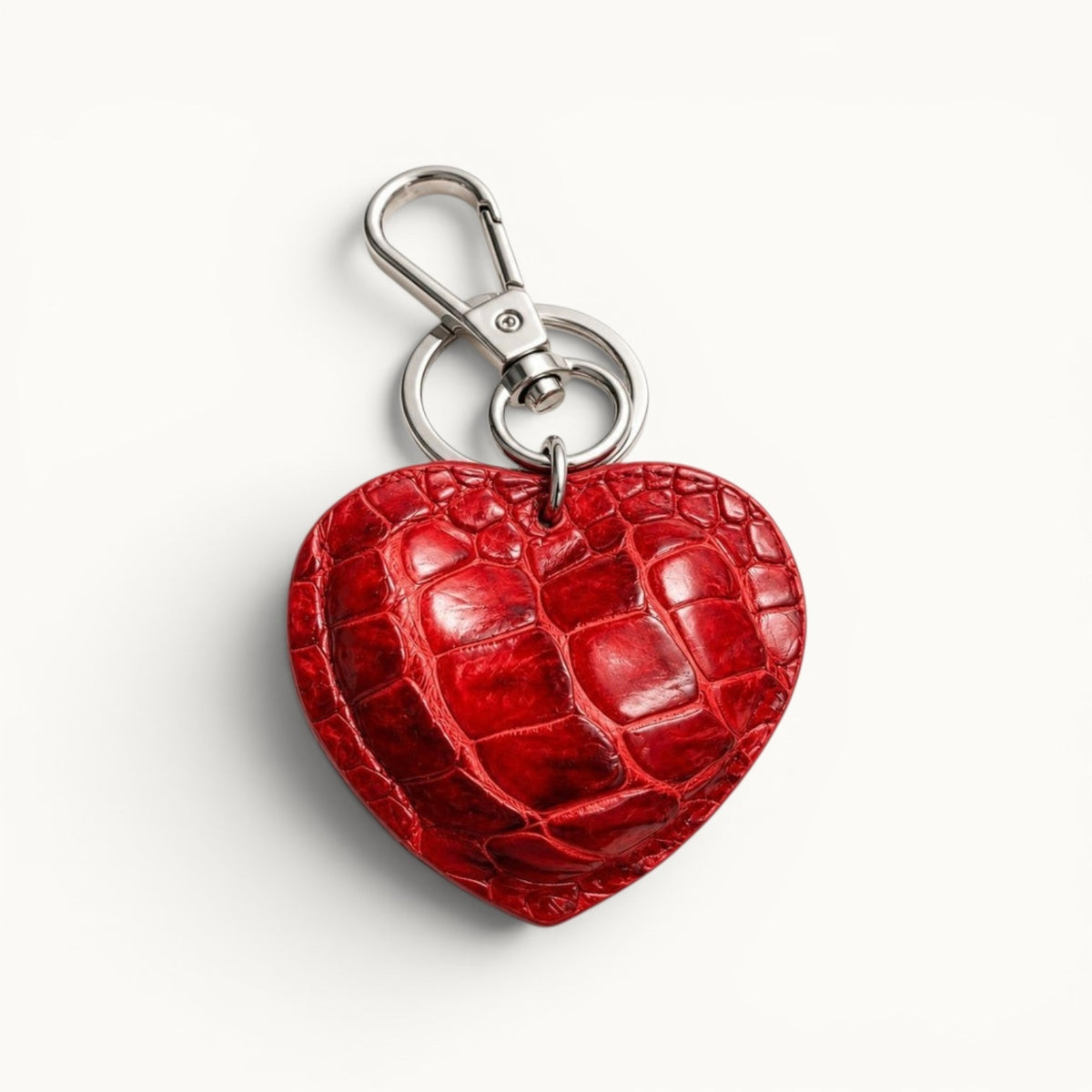 Ruby Red Siamese crocodile heart charm with polished silver-tone hardware, handcrafted luxury bag and key accessory.