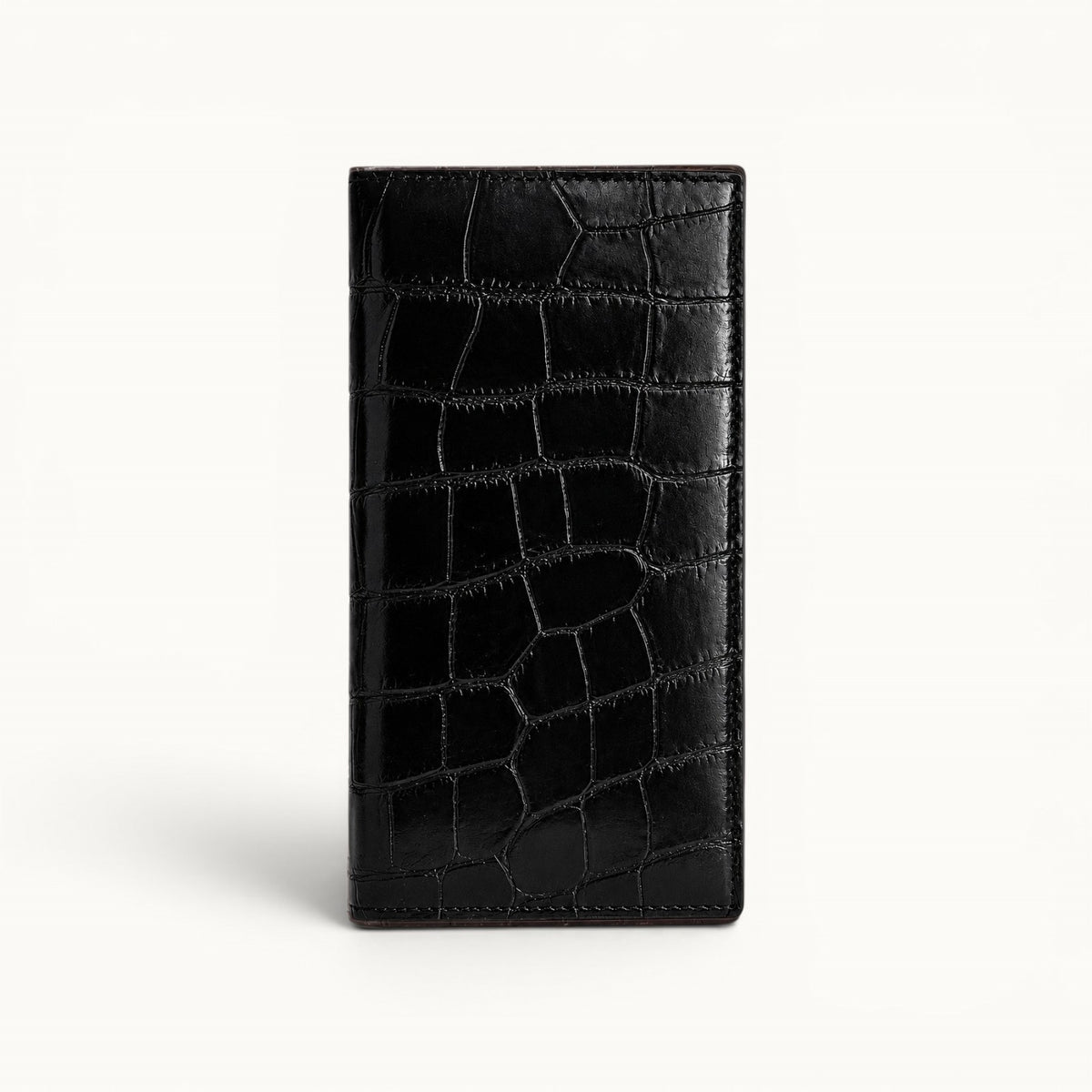The Kingsley Crocodile Long Wallet in black genuine crocodile leather featuring a slim profile and natural scale pattern.