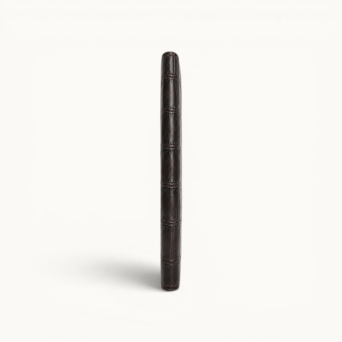 Slim side profile of The Kingsley Crocodile Long Wallet handcrafted from genuine crocodile leather in Imperial Mahogany, highlighting its elegant thin design.