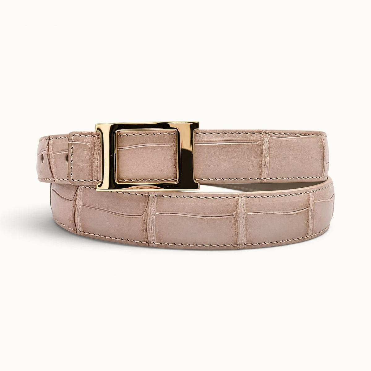 The Rosalie Crocodile Belt in Blush Pink, crafted from genuine Siamese crocodile belly leather with a sculptural gold-tone rectangular buckle.