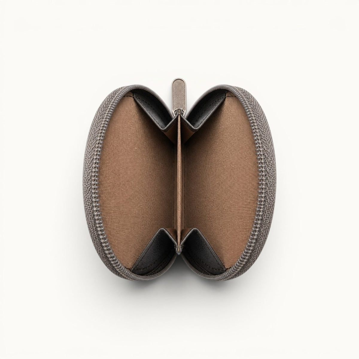 Open interior view of The Sovereign crocodile leather coin organizer with two spacious compartments, a central divider, and a secure zip-around closure.