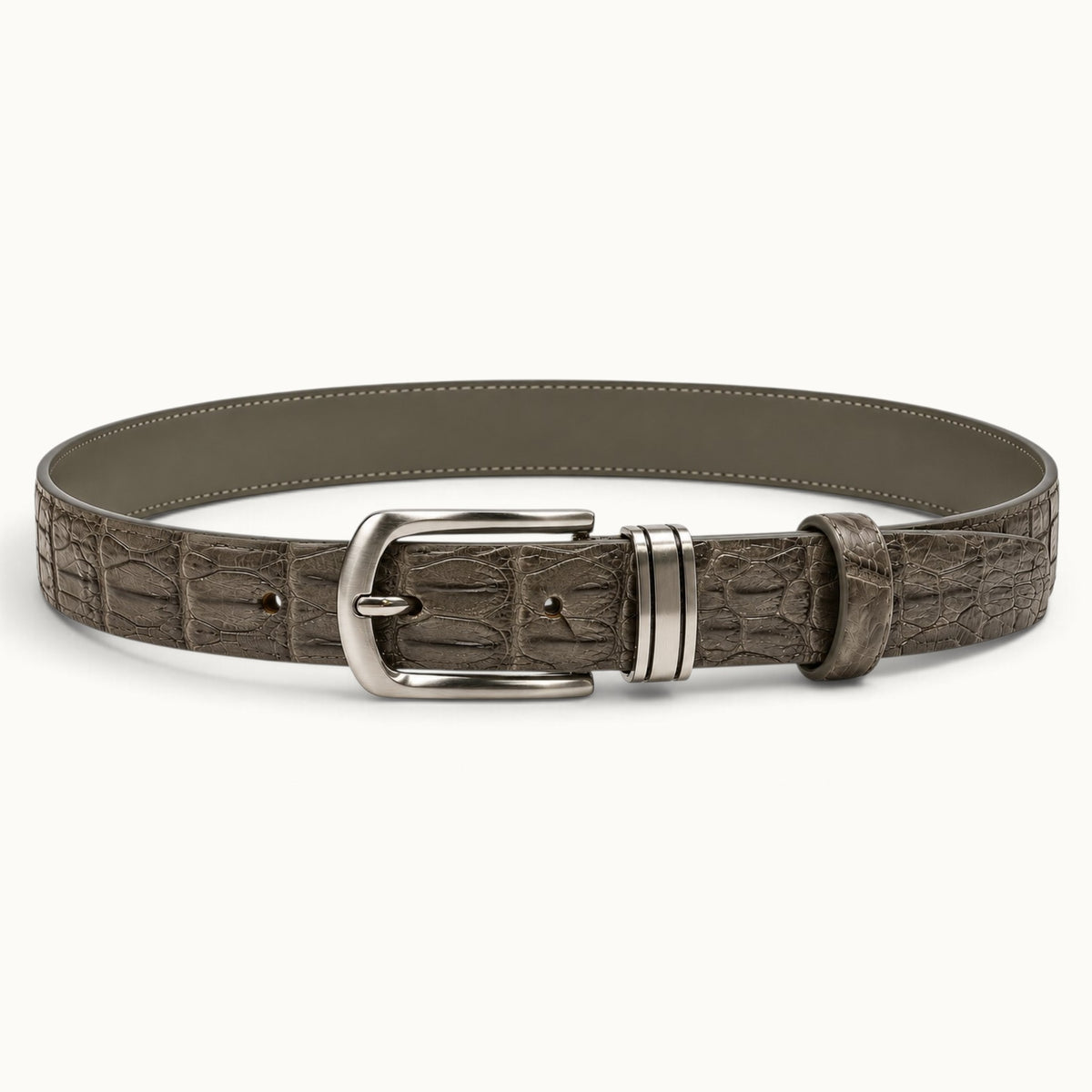 Full front view of The Waverly Crocodile Belt in Taupe Green, featuring a silver-tone buckle, three adjustment holes, and a two-row crocodile backstrap design.