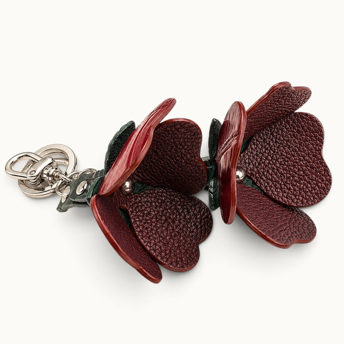 Interior view of the Bordeaux Red Valencia crocodile flower charm showing the cow leather reverse and petal construction