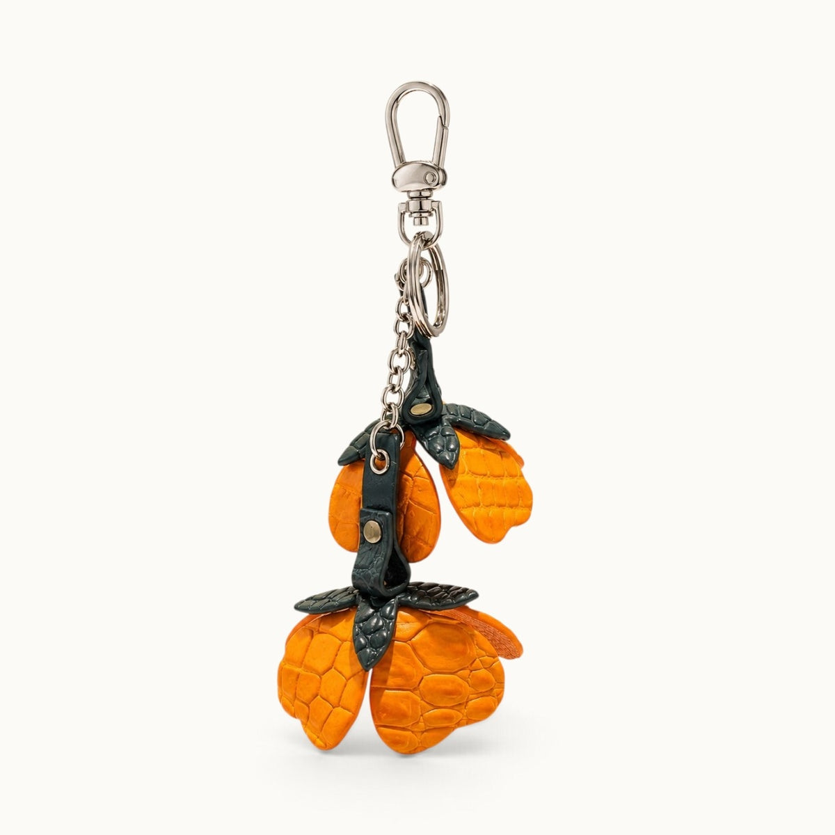 Three-quarter view of the Burnt Orange Valencia crocodile flower charm showing petal depth and construction